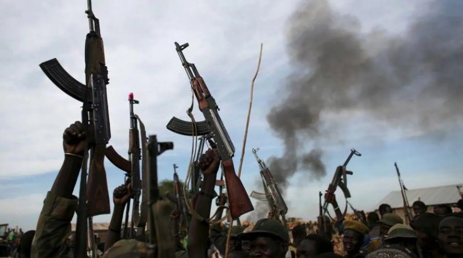 Rebel fighters hold up their rifles as they walk, Upper Nile State, South Sudan. File. REUTERS/Goran Tomasevic/File Photo
