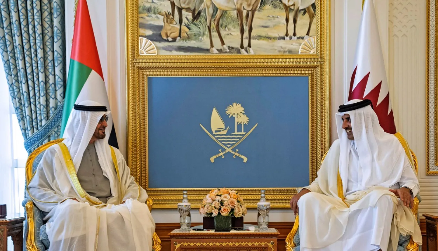 This handout picture provided by the UAE Ministry of Presidential Affairs shows Qatar's Emir Sheikh Tamim bin Hamad Al-Thani (R) meeting with Emirati President Sheikh Mohamed bin Zayed Al Nahyan in Doha, on December 5, 2022. (UAE's Ministry of Presidential Affairs / AFP)