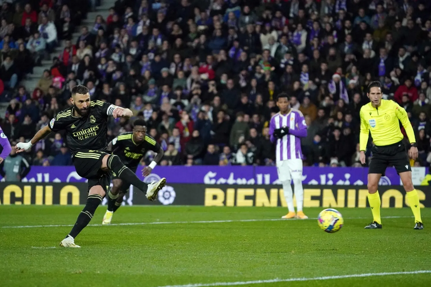 Real Madrid's French forward Karim Benzema scores his team's first goal from the penalty spot during the Spanish League football match between Real Valladolid FC and Real Madrid CF at the Jose Zorilla stadium in Valladolid on December 30, 2022. (AFP)