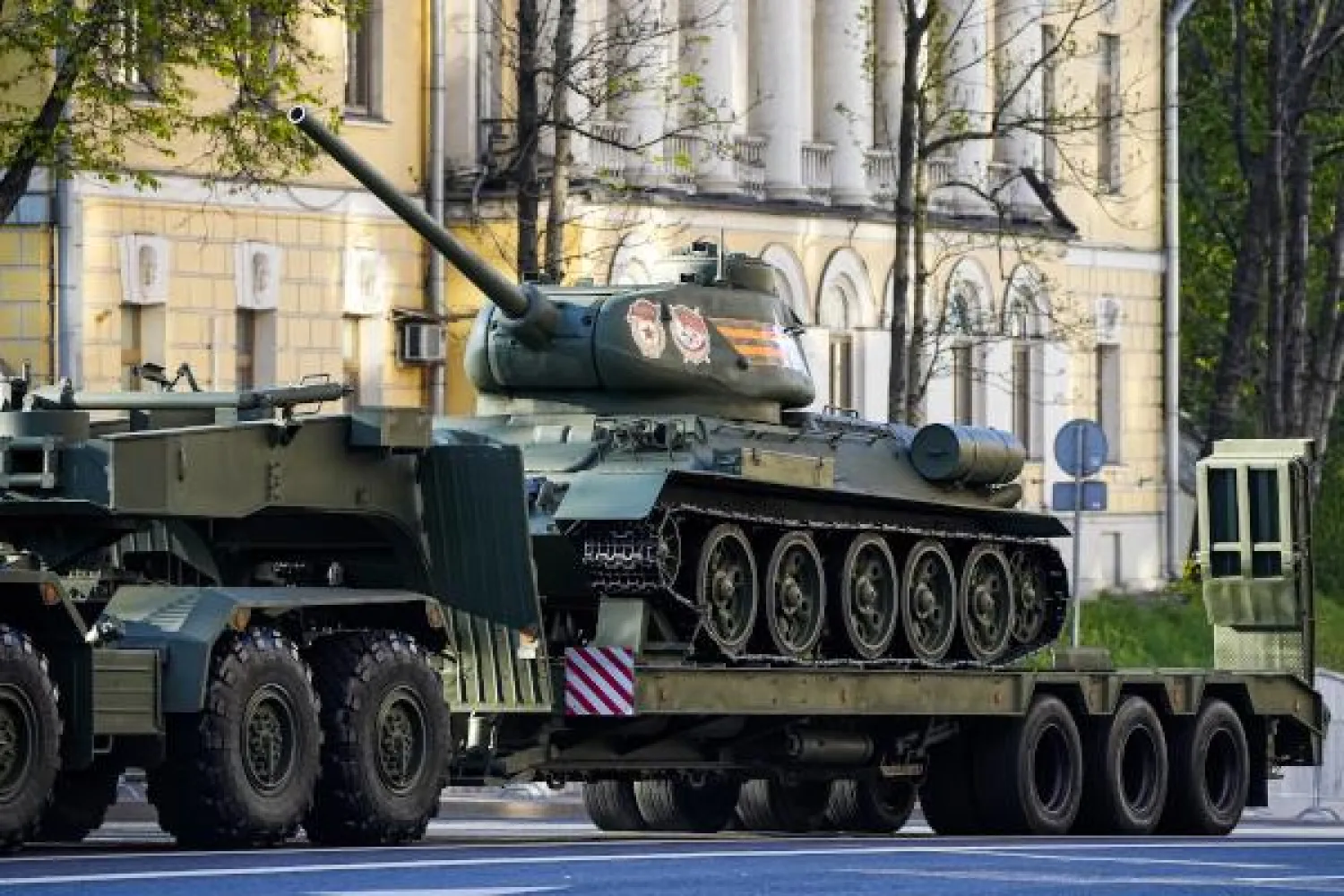 A Soviet era T-34 tank is transported toward Red Square to attend a dress rehearsal for the Victory Day military parade in Moscow, Russia, Sunday, May 7, 2023. (AP Photo)