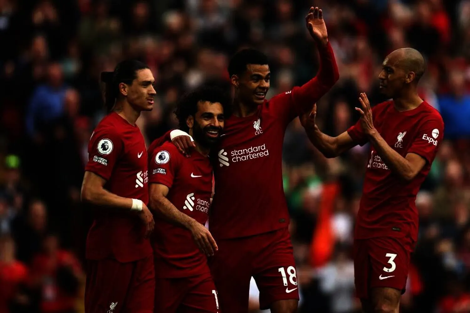 Liverpool's Egyptian striker Mohamed Salah (2L) celebrates with teammates after scoring his team's first goal during the English Premier League football match between Liverpool and Brentford at Anfield in Liverpool, north west England on May 6, 2023. (AFP) 