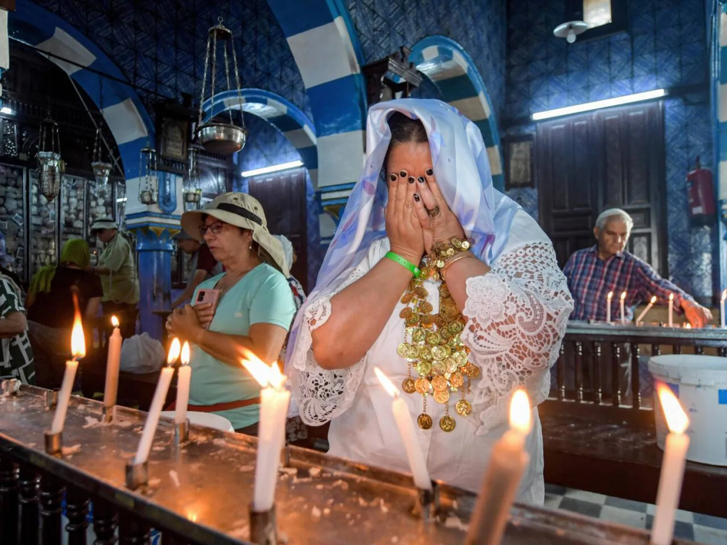 French Jewish pilgrims pray at the Ghriba synagogue in Tunisia's southern resort island of Djerba on May 18, 2022. Fethi Belaid, AFP
