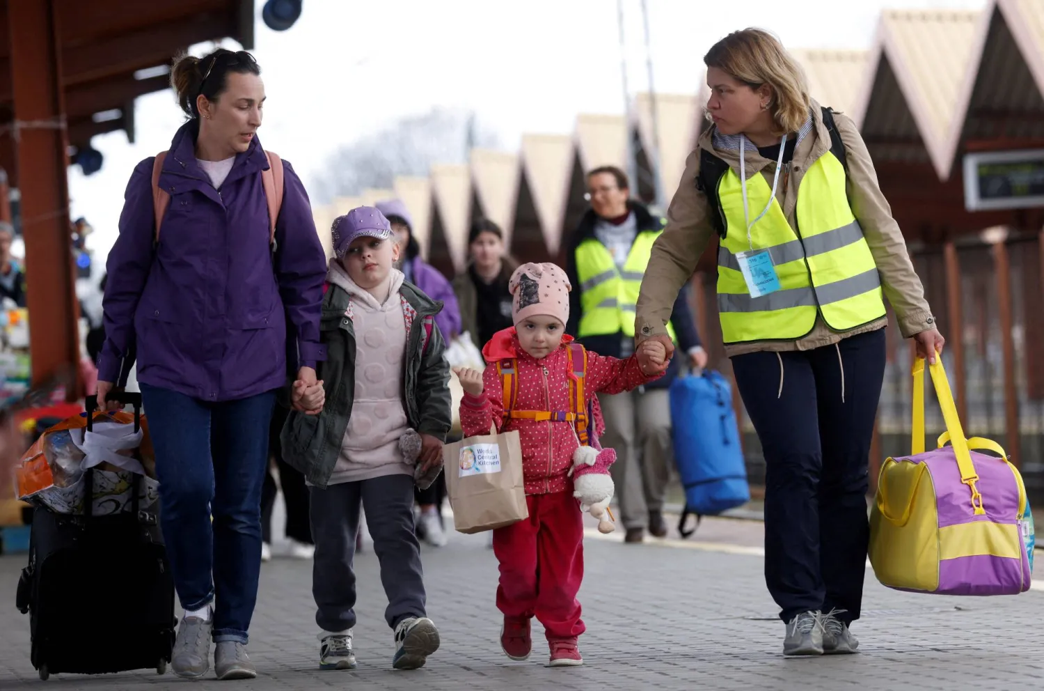 Ukrainian refugees walk on the platform after arriving on a train from Odesa at Przemysl Glowny train station, after fleeing the Russian invasion of Ukraine, in Przemysl, Poland, April 10, 2022. REUTERS/Leonhard Foeger/File Photo
