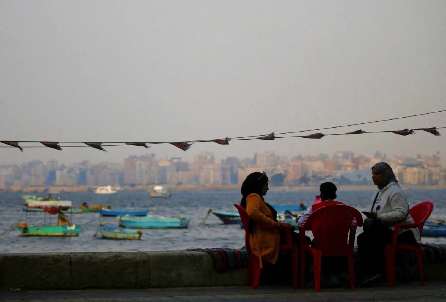 An Egyptian family at a café on the Mediterranean coast in Alexandria (Reuters)

