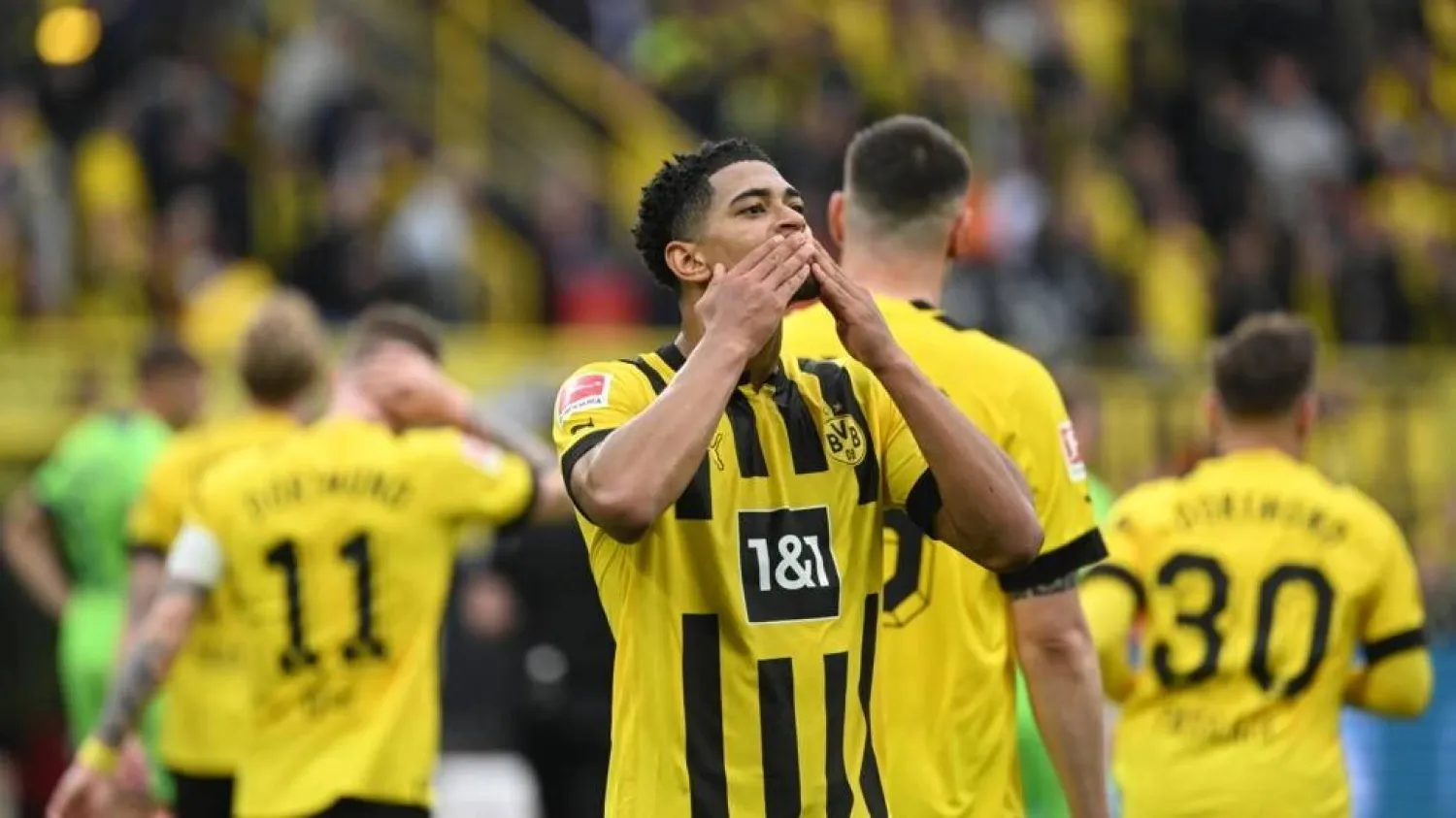 Dortmund midfielder Jude Bellingham shows his appreciation for the home fans during a 6-0 win over Wolfsburg. INA FASSBENDER / AFP
