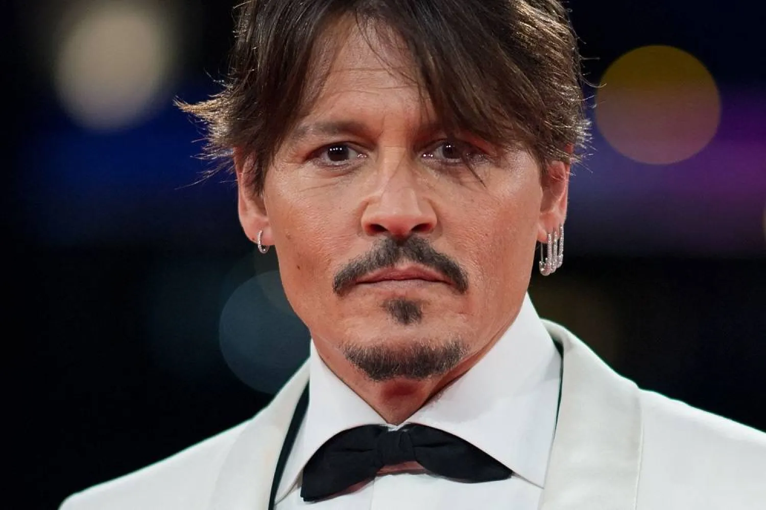 US actor Johnny Depp poses as he leaves after a tribute ceremony during the 45th Deauville US Film Festival, in Deauville, northern France, on September 8, 2019. (AFP) 