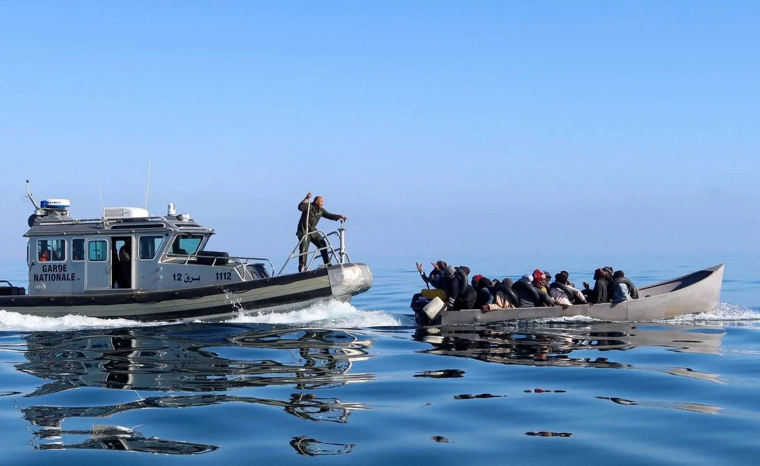 FILE PHOTO: Tunisian coast guards try to stop migrants at sea during their attempt to cross to Italy, off the coast off Sfax, Tunisia April 27, 2023. REUTERS/Jihed Abidellaoui/File Photo