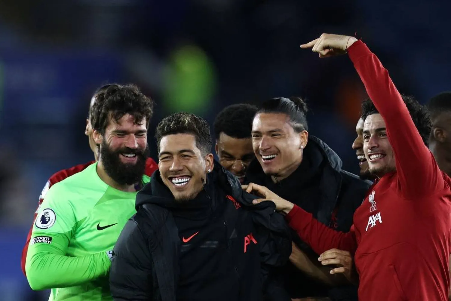 Liverpool's Brazilian striker Roberto Firmino (C) celebrates with teammates at the end of the English Premier League football match between Leicester City and Liverpool at King Power Stadium in Leicester, central England on May 15, 2023. (AFP) 