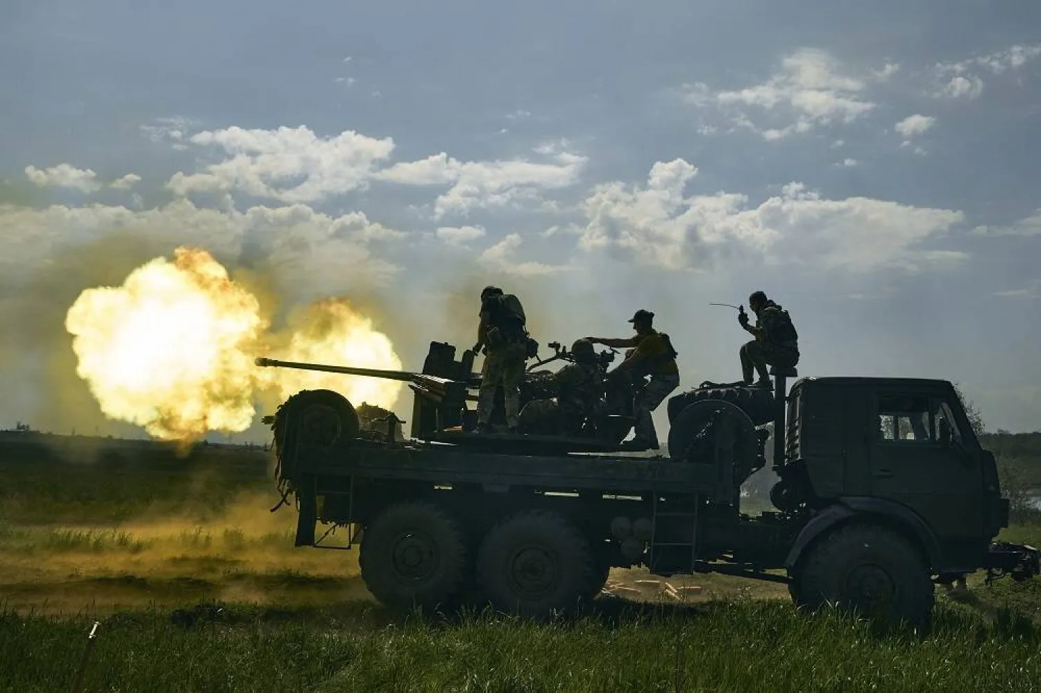 Ukrainian soldiers fire a cannon near Bakhmut, an eastern city where fierce battles against Russian forces have been taking place, in the Donetsk region, Ukraine, May 15, 2023. (AP) 