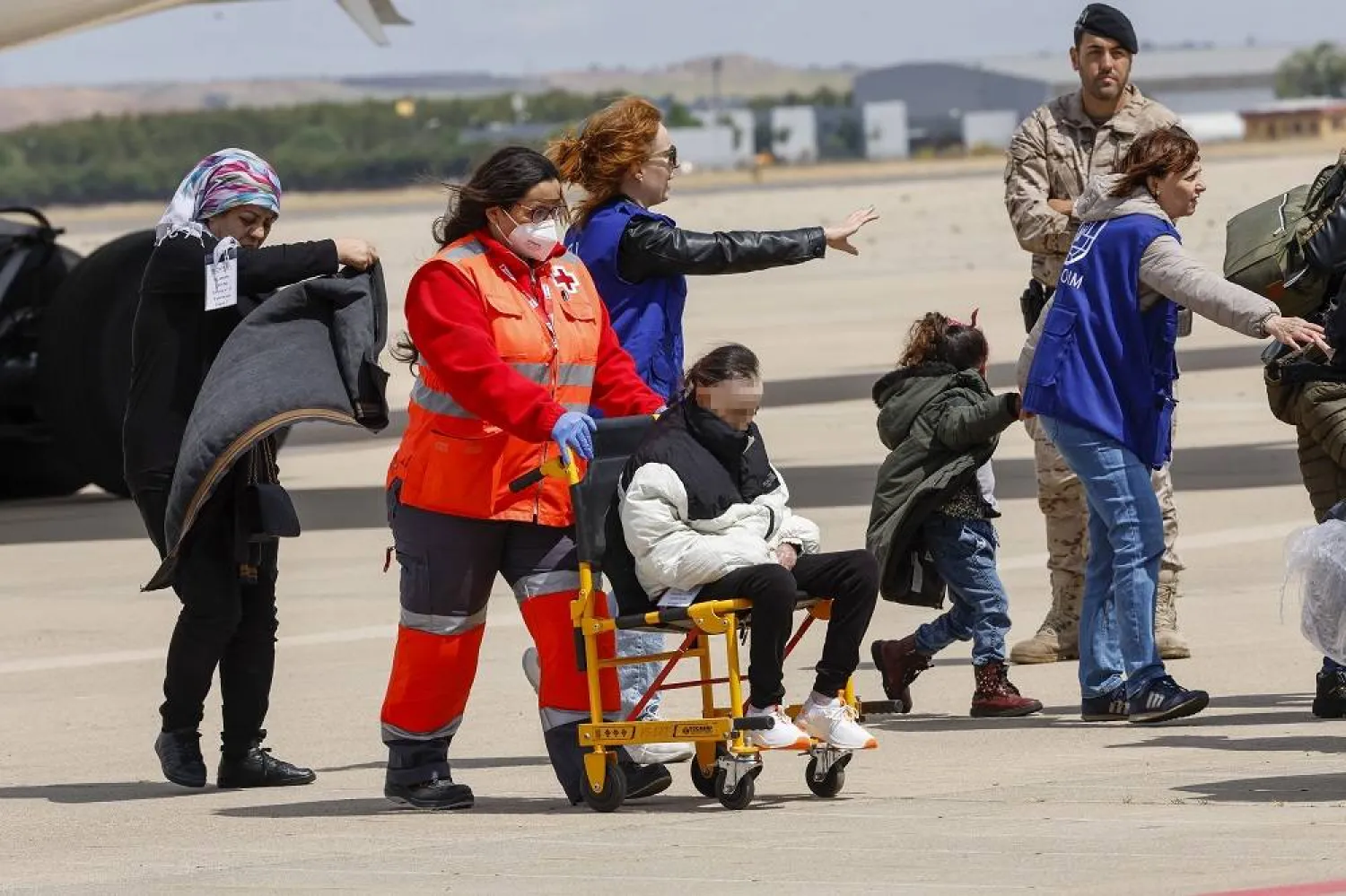 Syrian refugees of the second contingent of people affected by the earthquake in Türkiye on 06 February 2023 arrive on a plane from Istanbul (Türkiye) to Torrejon de Ardoz' military air base in Madrid province, central Spain, 19 May 2023. (EPA) 