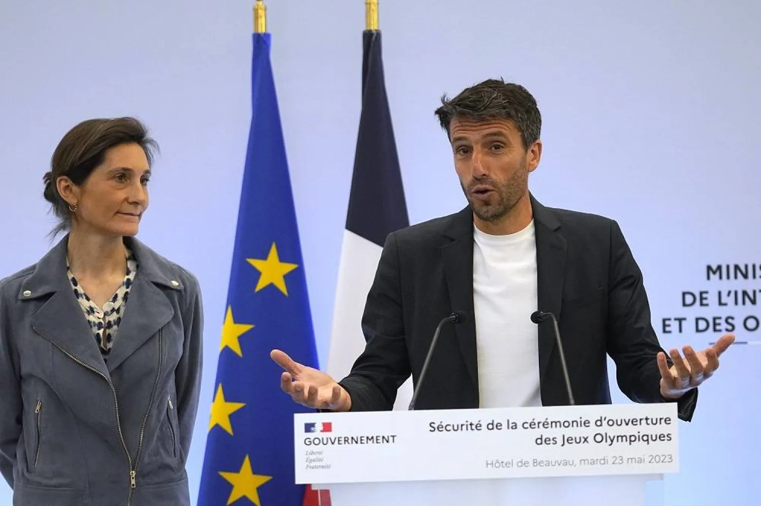 French Sports Minister Amelie Oudea-Castera, watches head of Paris 2024 Olympics Tony Estanguet delivering a speech during a meeting on the Paris 2024 Olympics opening ceremony, Tuesday, May 23, 2023 in Paris. (AP) 