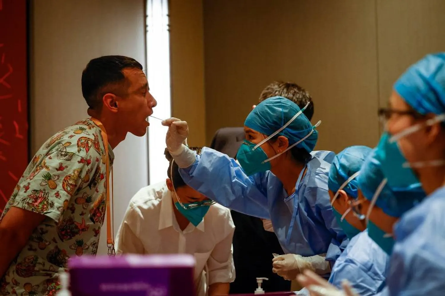 A journalist undergoes a Covid-19 PCR test ahead of the China-Central Asia Summit welcome ceremony at a hotel in Xi'an, Shaanxi province, China, 18 May 2023. (EPA) 