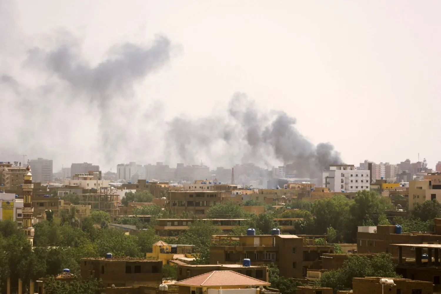 Smoke rises over buildings during clashes between the paramilitary Rapid Support Forces and the army in Khartoum, Sudan (Reuters)