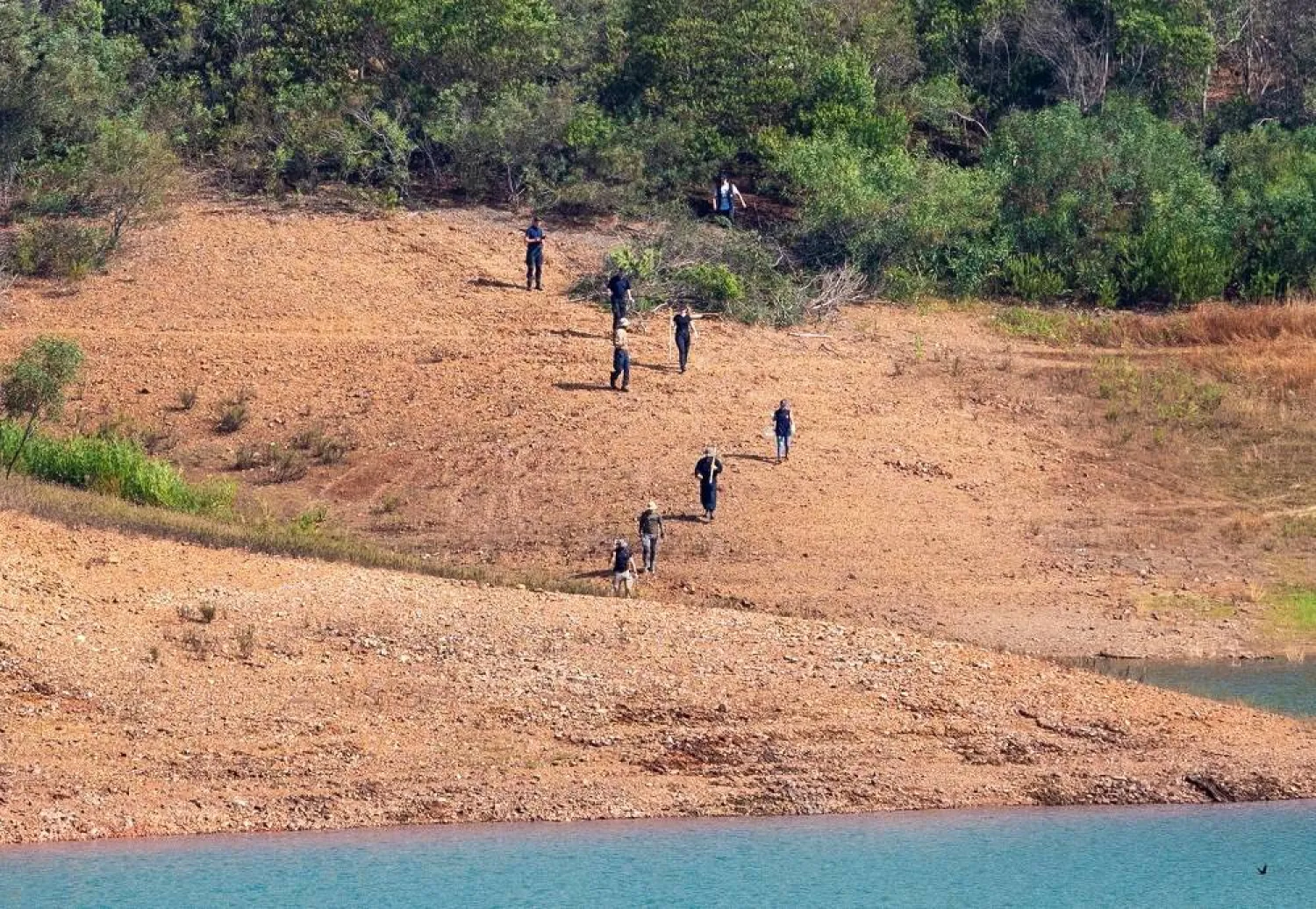 Portuguese and German police search a reservoir near the area where British girl Madeleine McCann went missing in the Portuguese Algarve in May 2007, in Silves, Portugal, May 24, 2023. (Reuters) 