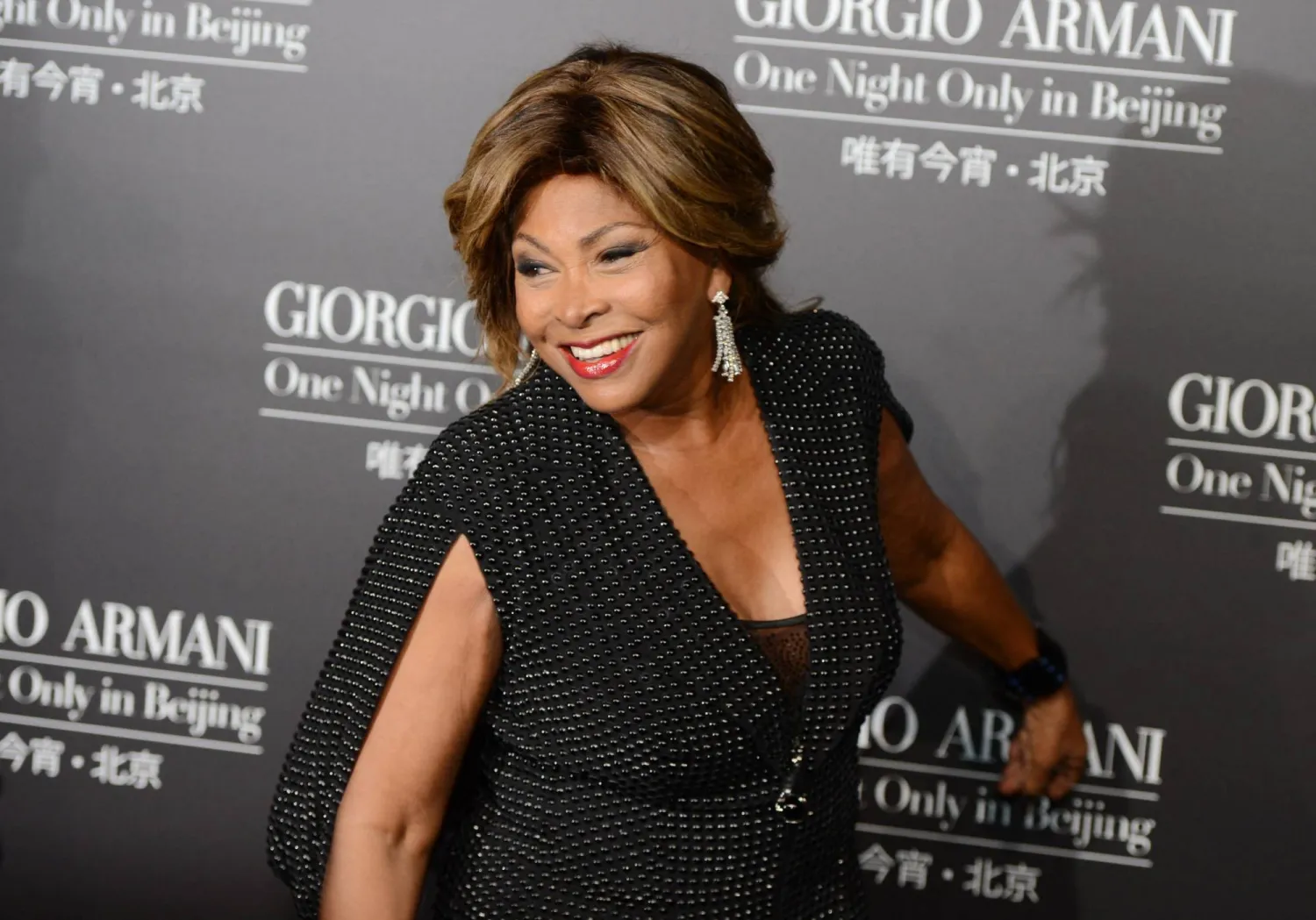 Singer Tina Turner arrives on the red carpet for the fashion show by 77-year-old designer Giorgio Armani at the 798 art complex in Beijing on May 31, 2012 . (Photo by MARK RALSTON / AFP)