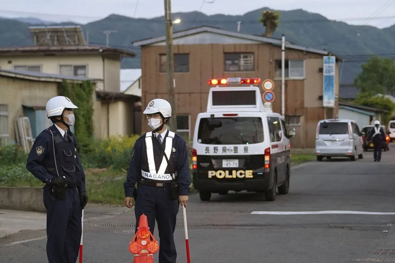 Police officers stand near the scene of a stabbing and shooting incident in Nakano, Nagano Prefecture, Japan, in this photo taken by Kyodo on May 25, 2023. (Kyodo via Reuters) 