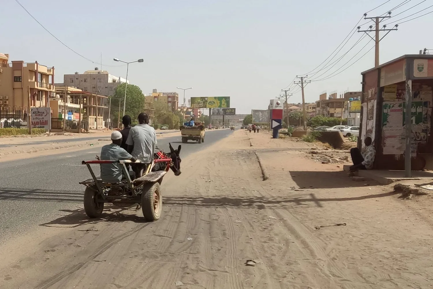 A man rides his donkey-drawn carriage in southern Khartoum on May 25, 2023. (Photo by AFP)