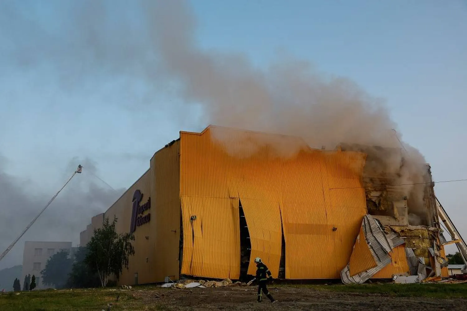 A firefighter works at a site of a tobacco factory damaged during Russian suicide drone strike, amid Russia's attack on Ukraine, in Kyiv, Ukraine May 28, 2023. (Reuters) 