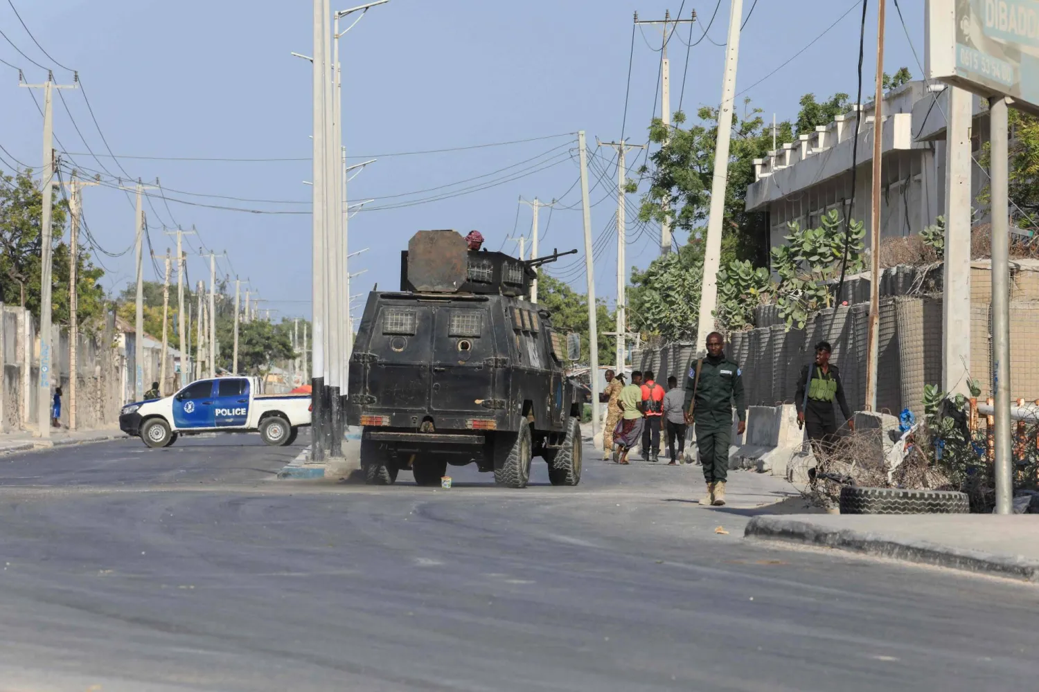 (FILES) Security forces patrol outside a building which was attacked by suspected Al Shabaab militants in the Somalia's capital Mogadishu, on February 21, 2023. (Photo by Hassan Ali ELMI / AFP)

