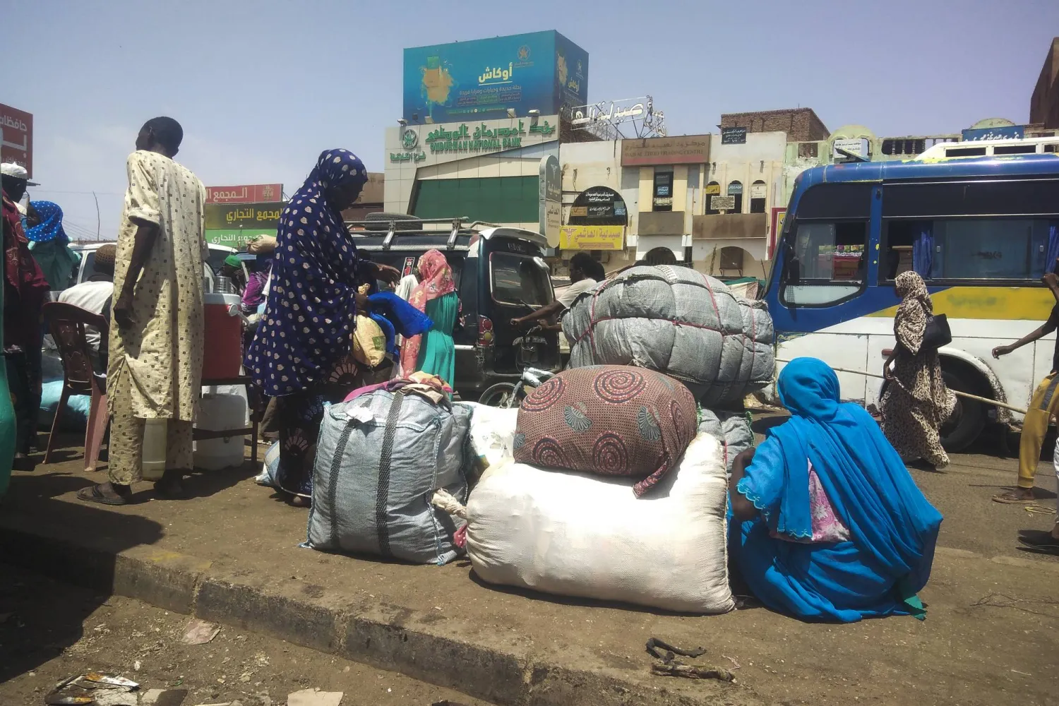 People board a bus to leave Khartoum, Sudan, Saturday, June 3, 2023, as fighting between the Sudanese Army and Rapid Support Forces intensified. (AP Photo)
