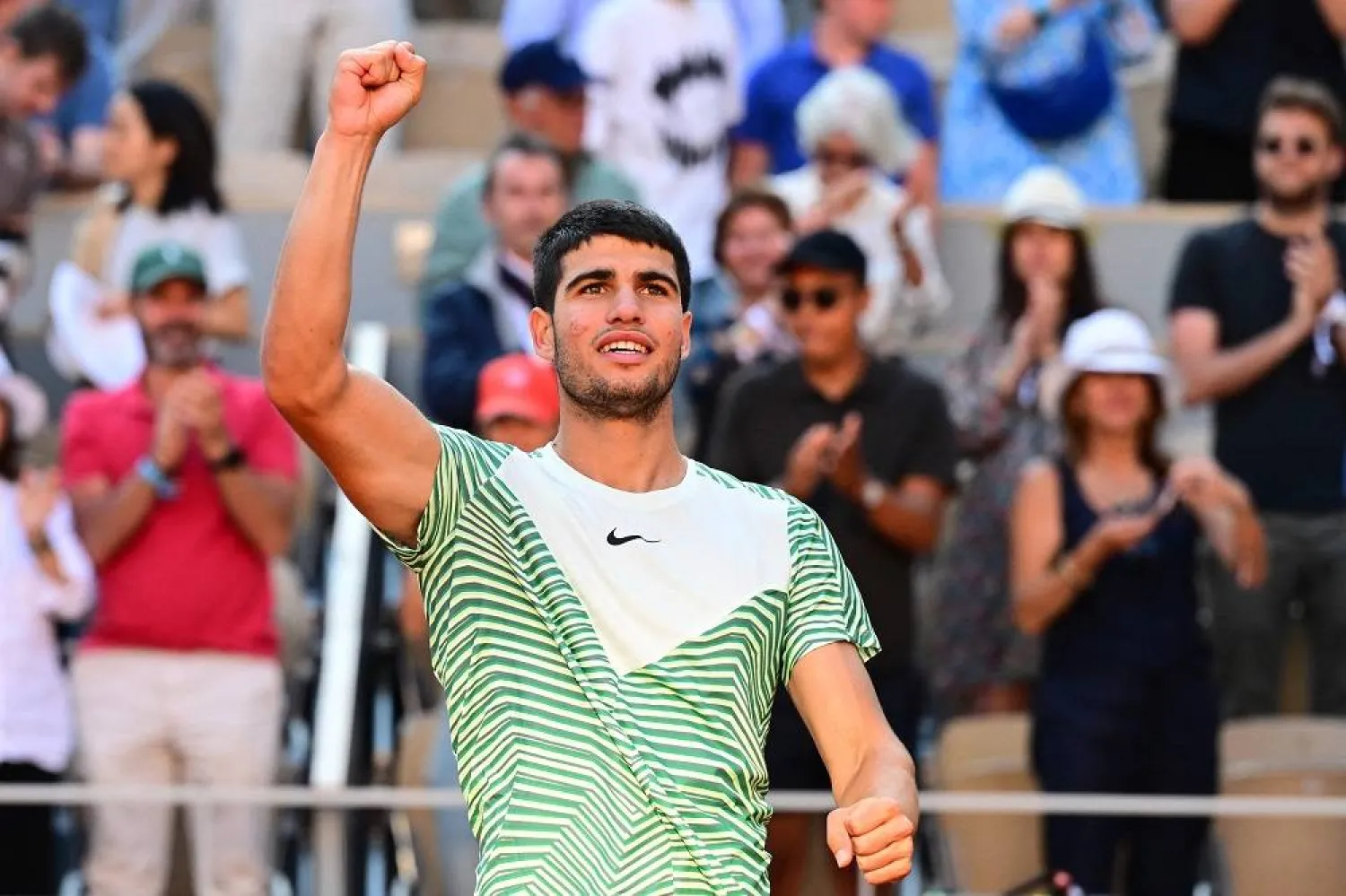 Spain's Carlos Alcaraz celebrates his victory over Italy's Lorenzo Musetti during their men's singles match on day eight of the Roland-Garros Open tennis tournament at the Court Philippe-Chatrier in Paris on June 4, 2023. (AFP) 