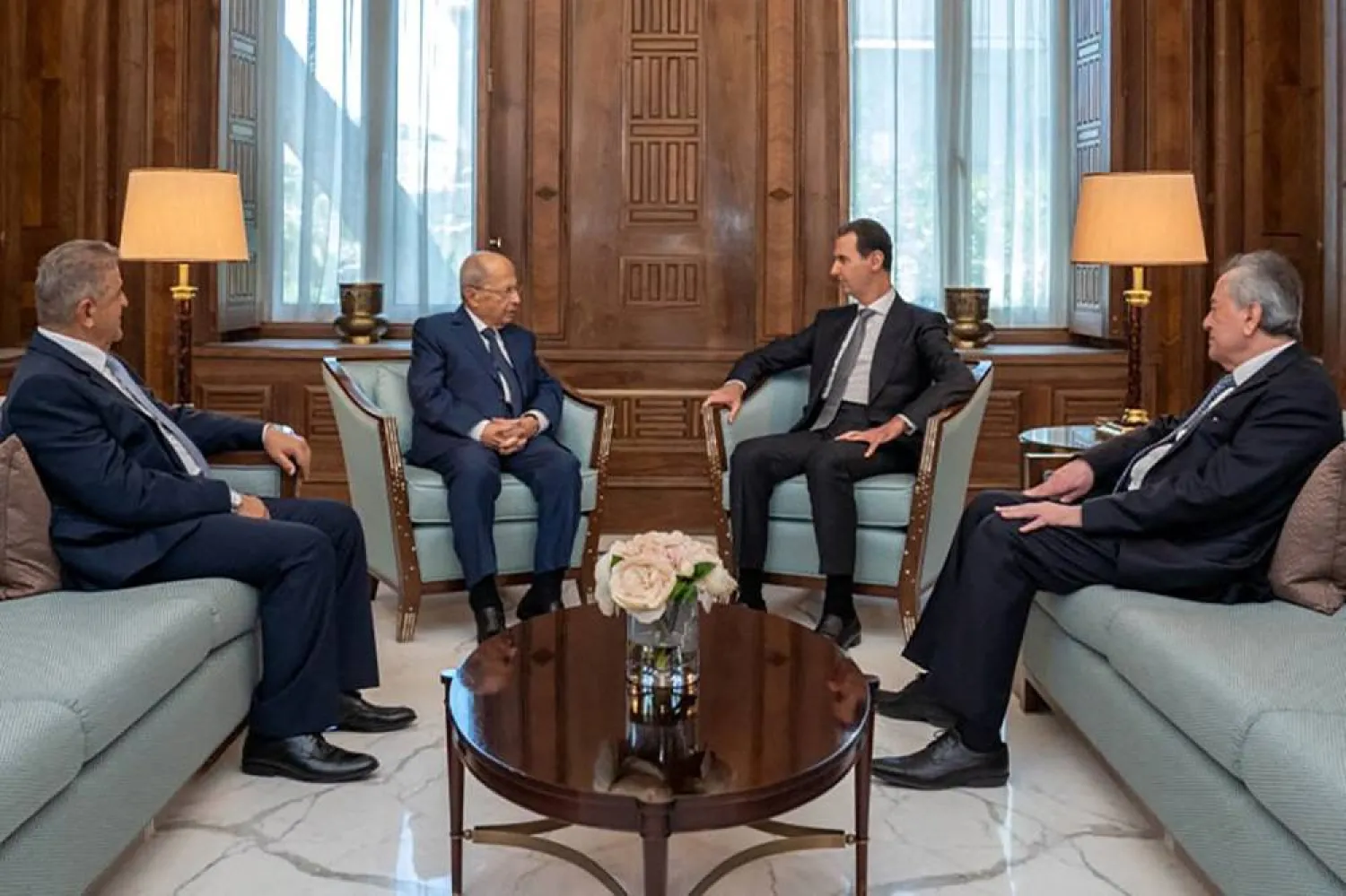 This handout picture released by the Syrian Presidency shows Syrian President Bashar al-Assad (C-R) meeting with Lebanese former President Michel Aoun (C-L) in Damascus on June 6, 2023. (Syrian Presidency / AFP) 