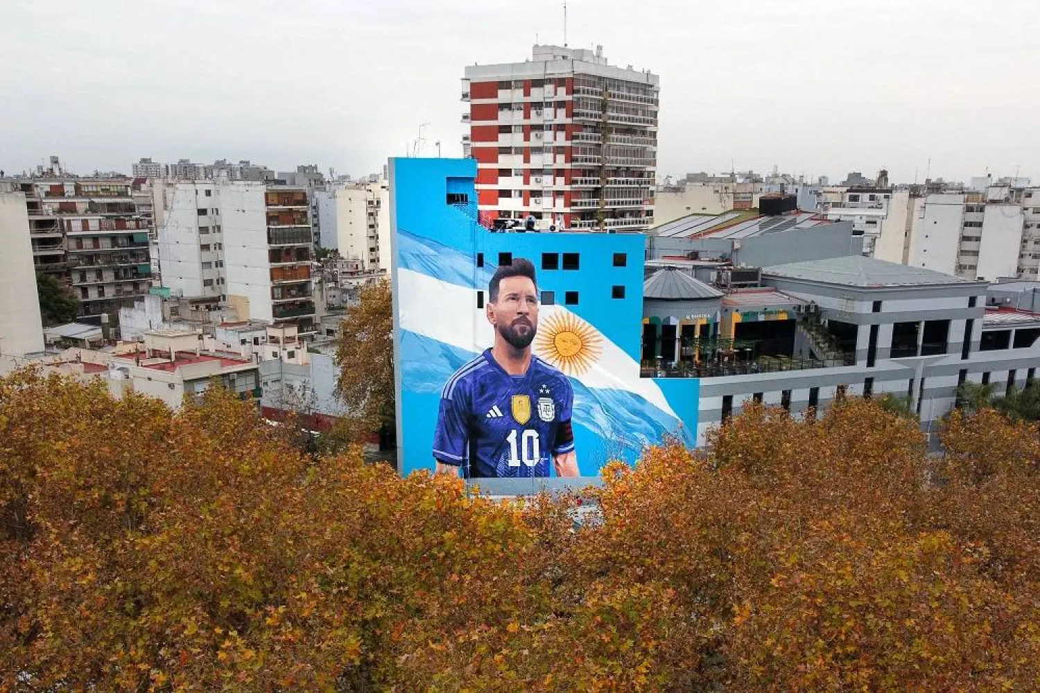 Aerial view of a mural painting depicting Argentine football star Lionel Messi at the Villa del Parque train station in Buenos Aires taken on June 6, 2023. (AFP) 