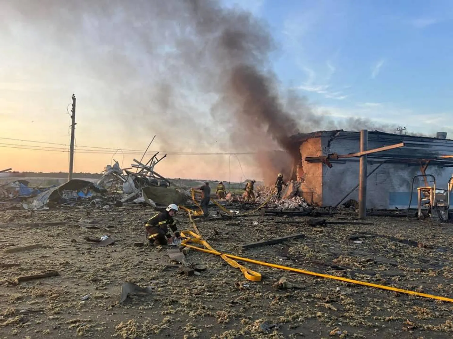 Firefighters work at a site of a car wash heavily damaged by a Russian missile strike, amid Russia's attack on Ukraine, in the town of Uman, Cherkasy region, Ukraine, in this handout picture released June 9, 2023. Handout via REUTERS  