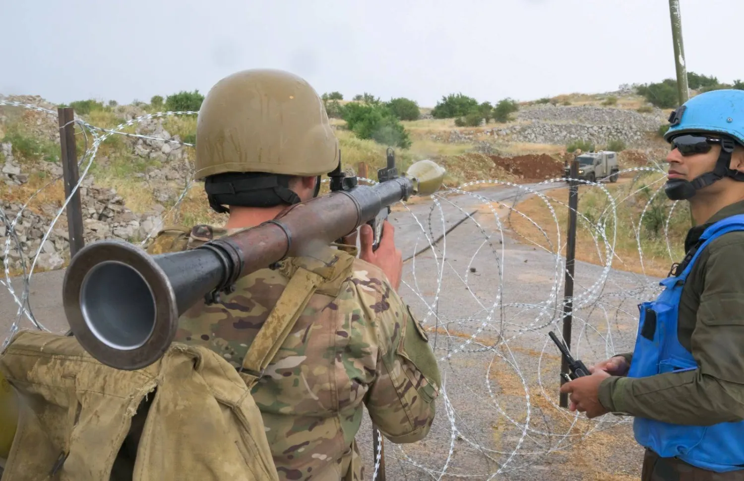 A Lebanese soldier in combat position facing an Israeli patrol. (Asharq Al-Awsat)