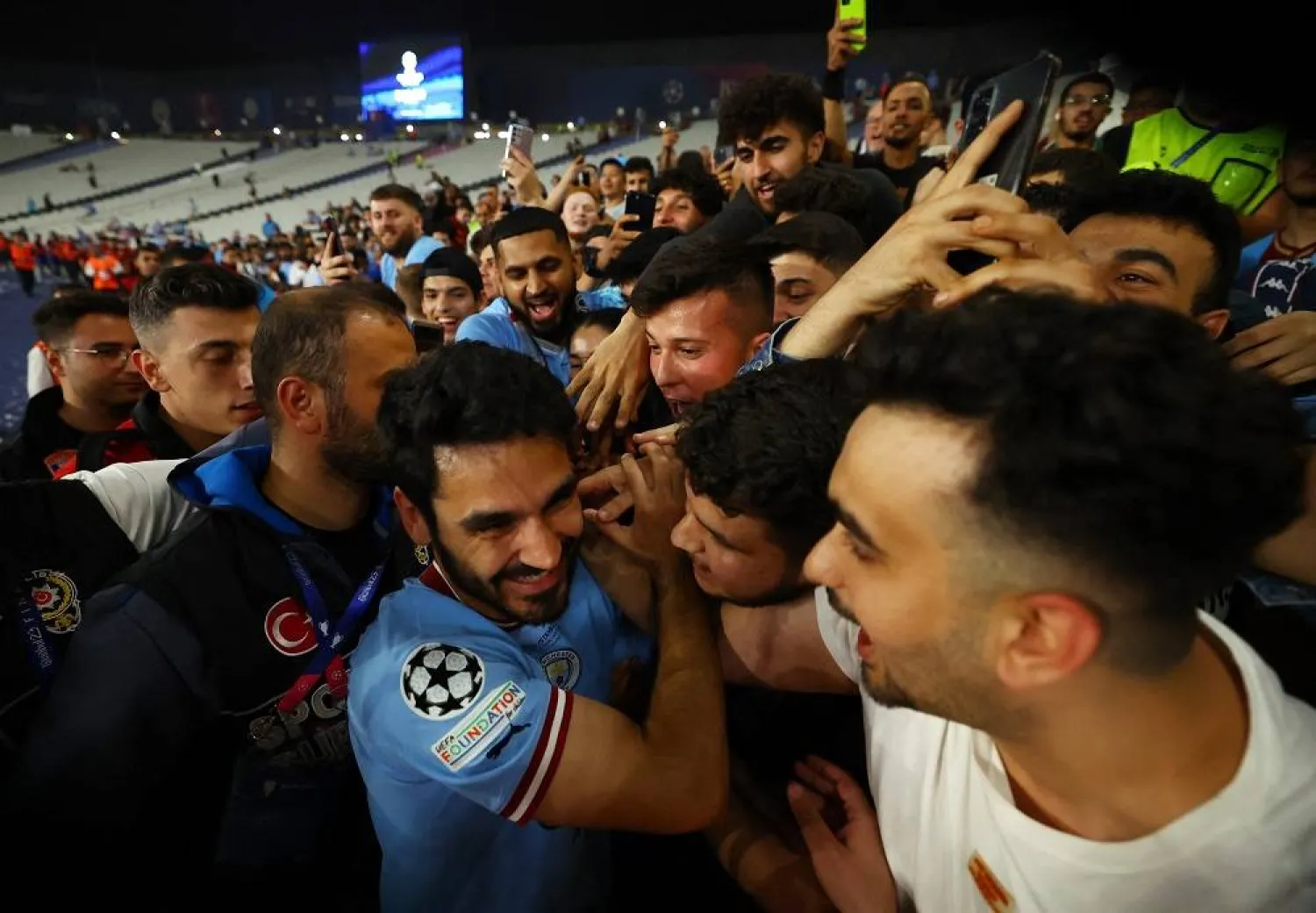 Football - Champions League Final - Manchester City v Inter Milan - Ataturk Olympic Stadium, Istanbul, Türkiye - June 11, 2023 Manchester City's Ilkay Gundogan celebrates with fans after winning the Champions League. (Reuters) 