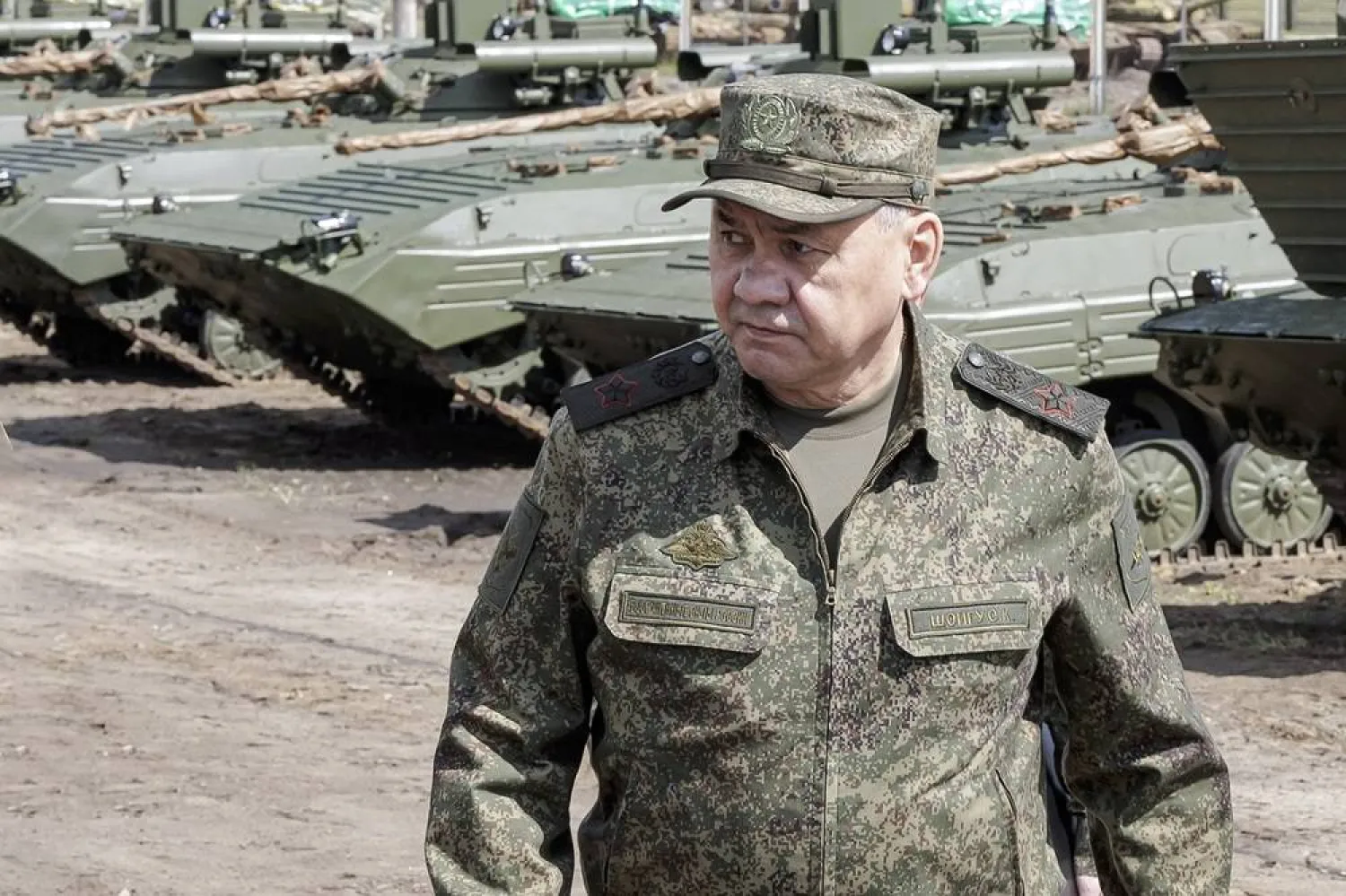 This photo taken and released by Russian Defense Ministry Press Service on Thursday, June 8, 2023, Russian Defense Minister Sergei Shoigu inspects the preparation of equipment and weapons for shipment to the zone of the special military operation at the arsenals and storage bases of the Western Military District at an undisclosed location in Russia. (Russian Defense Ministry Press Service via AP) 