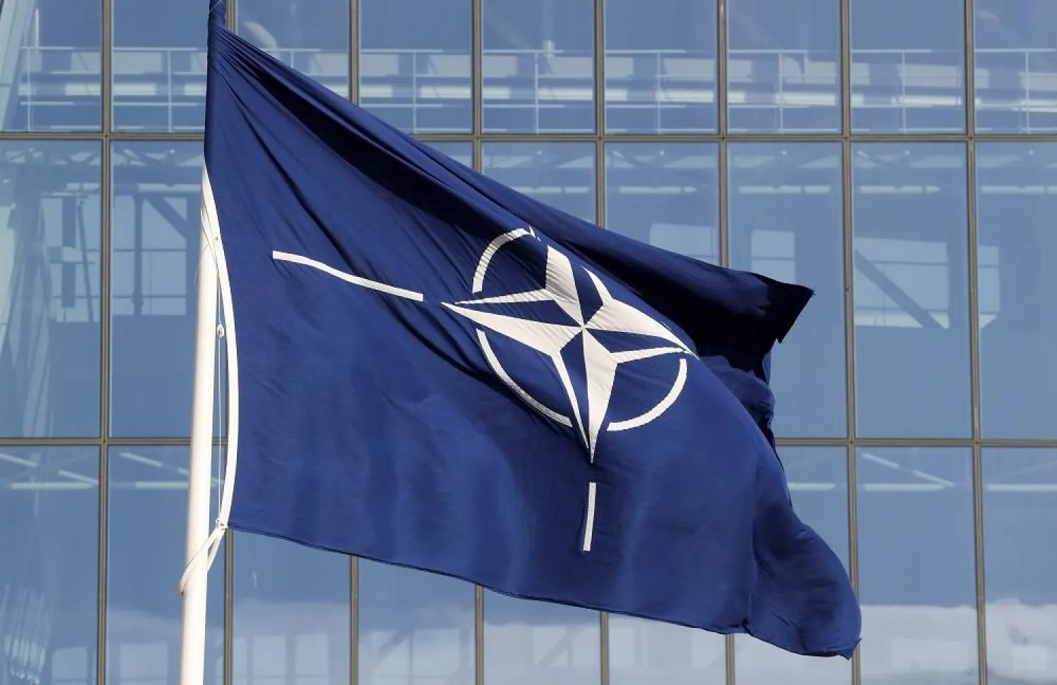 A NATO flag is seen at the Alliance headquarters ahead of a NATO Defense Ministers meeting, in Brussels, Belgium, October 21, 2021. (Reuters)