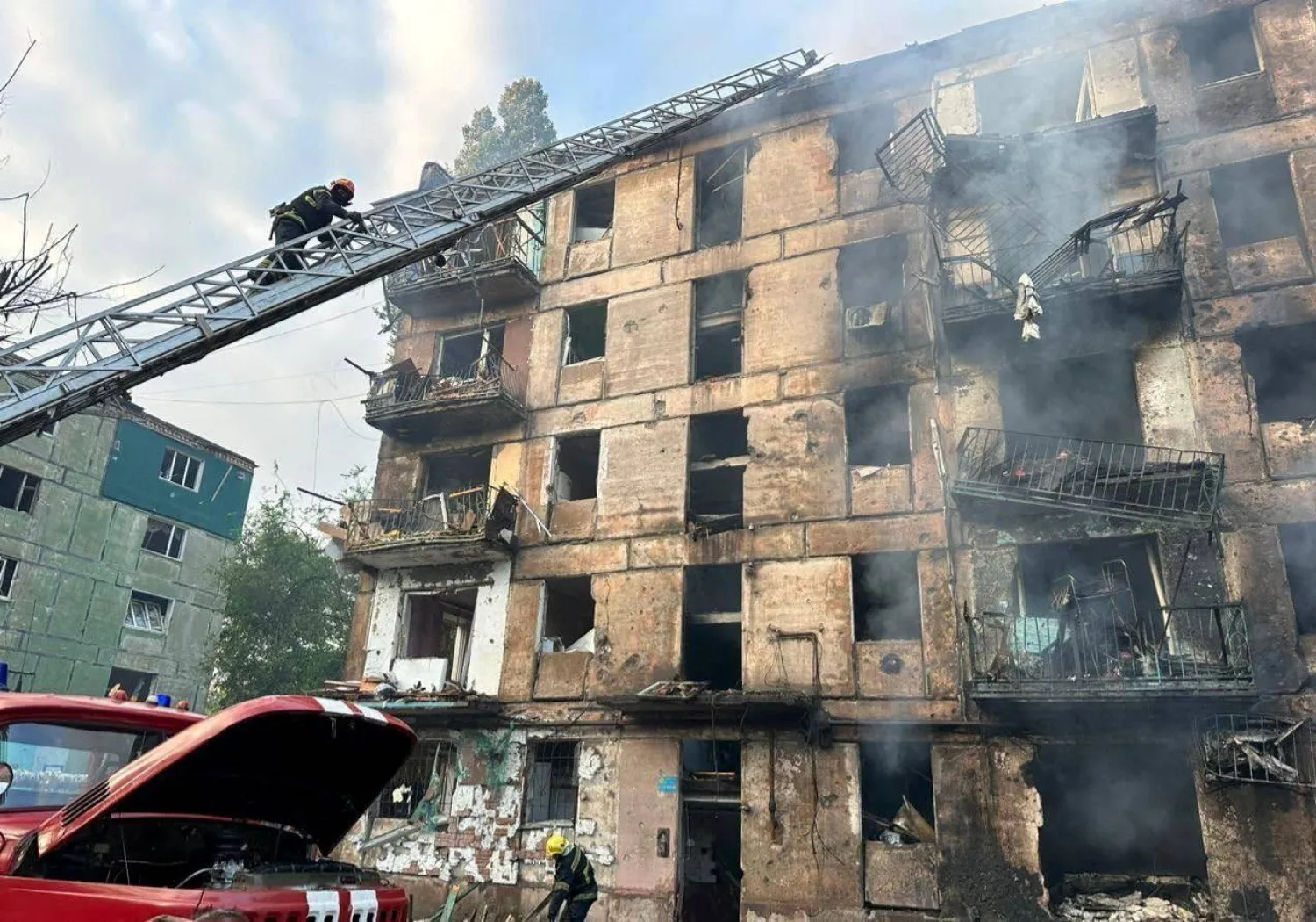 Rescuers work at a site of a residential building heavily damaged by a Russian missile strike, amid Russia's attack on Ukraine, in Kryvyi Rih, Dnipropetrovsk region, Ukraine June 13, 2023. Governor of Dnipropetrovsk Regional Military-Civil Administration Serhii Lysak via Telegram/Handout via REUTERS 