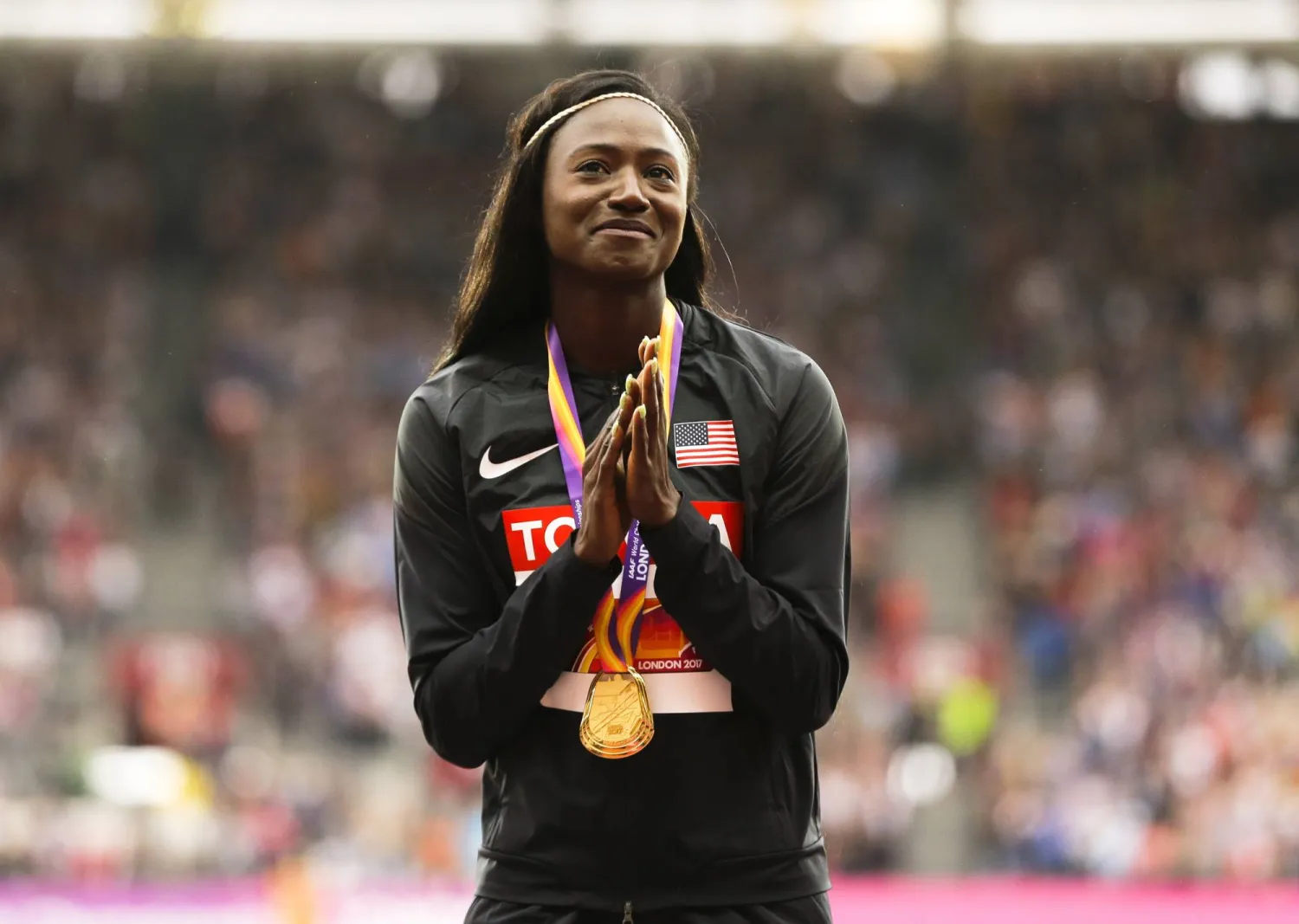 FILE - United States' Tori Bowie gestures after receiving the gold medal she won in the women's 100m final during the World Athletics Championships in London, Monday, Aug. 7, 2017. (AP Photo/Alastair Grant, File)