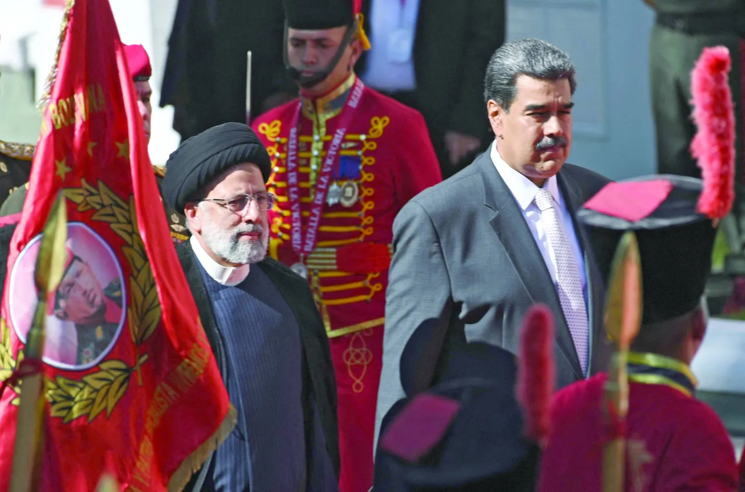 Iranian President Ebrahim Raisi (L) is welcomed by Venezuelan President Nicolas Maduro at Miraflores Presidential Palace in Caracas, on June 12, 2023. (Photo by Yuri CORTEZ / AFP)