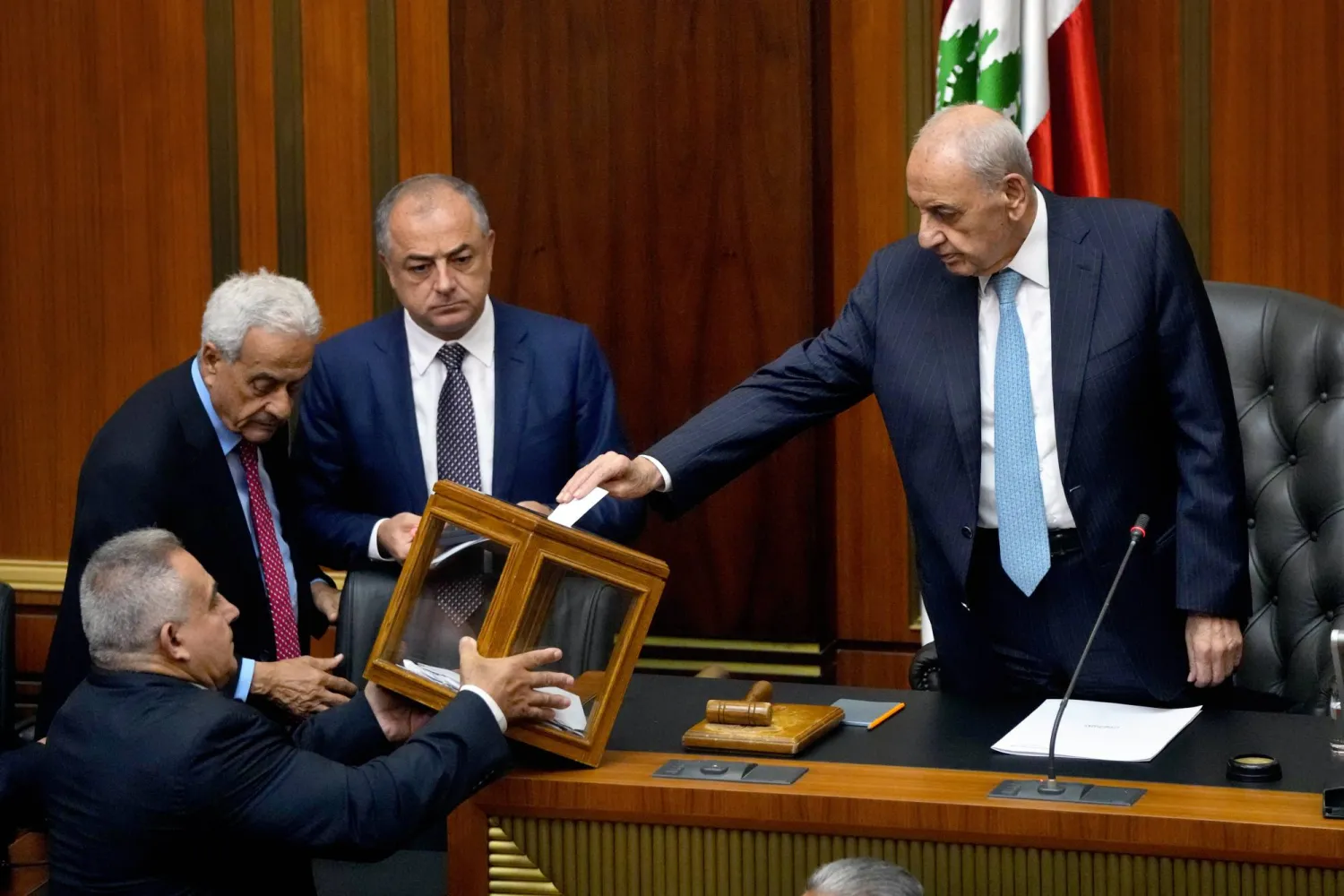 Lebanese Parliament Speaker Nabih Berri, right, casts his vote as parliament gathers to elect a president at the parliament building in downtown Beirut, Lebanon, Wednesday, June 14, 2023. (AP Photo/Hassan Ammar)