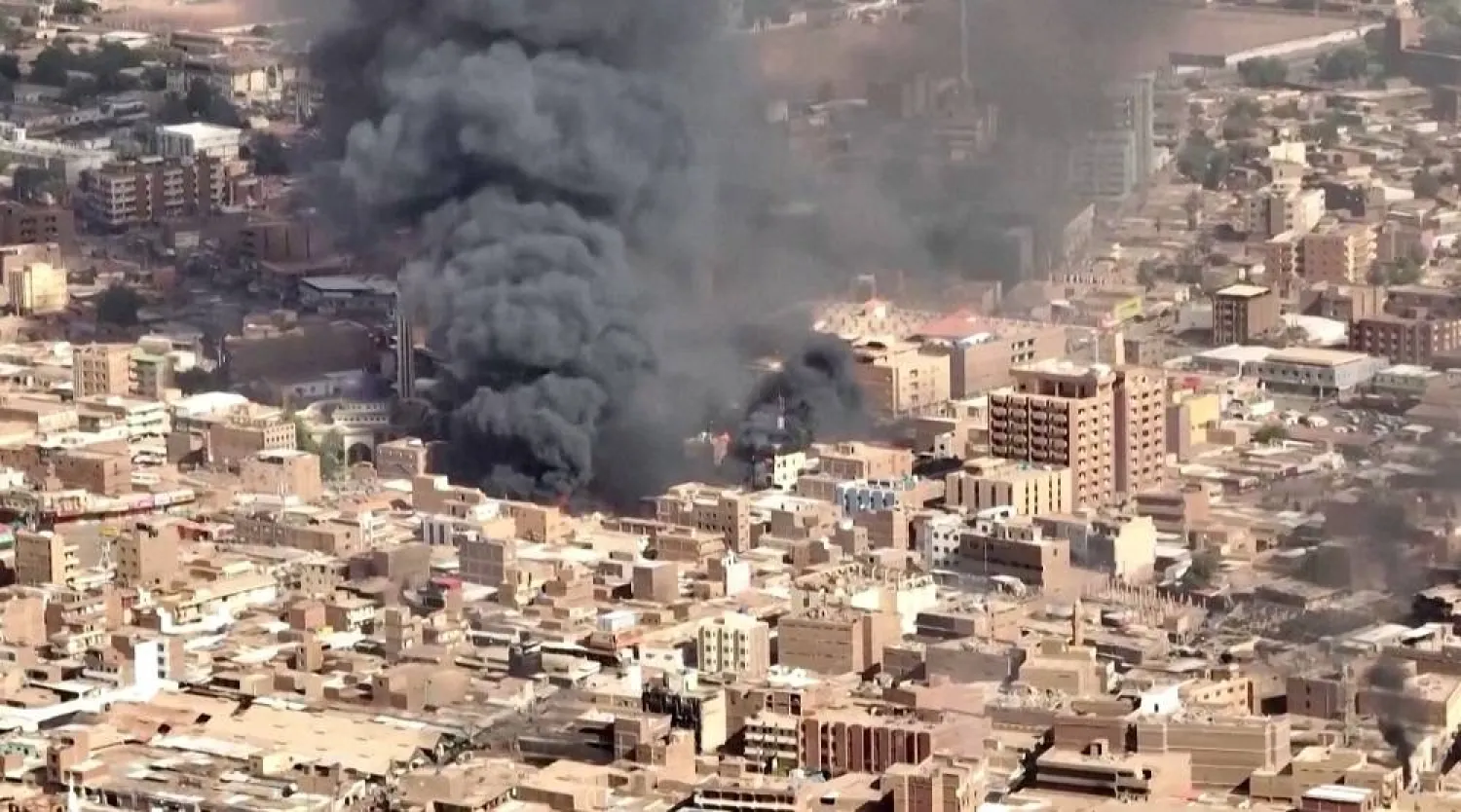An aerial view of the black smoke and flames at a market in Omdurman, Khartoum North, Sudan, May 17, 2023 in this screengrab obtained from a handout video. (Video grab obtained by Reuters) 