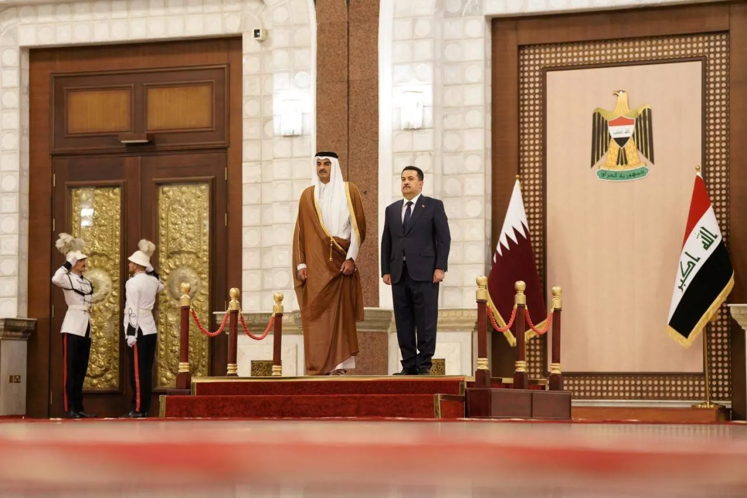 Iraqi Prime Minister Mohammed Shia al-Sudani with Qatar's Emir Sheikh Tamim bin Hamad al-Thani during a welcome ceremony in Baghdad (Iraqi Prime Minister Media Office)