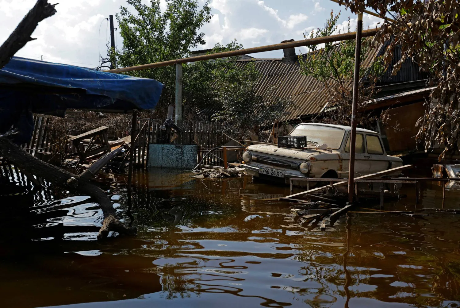 A view shows a Soviet-made Zaporozhets car in a street after floodwaters receded following the collapse of the Nova Kakhovka dam in the course of Russia-Ukraine conflict, in the town of Hola Prystan in the Kherson region, Russian-controlled Ukraine, June 16, 2023. REUTERS/Alexander Ermochenko     