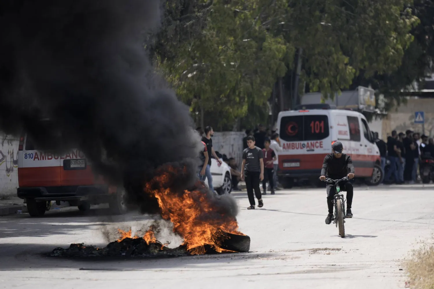 Tires burn during clashes between Israeli forces and Palestinians in the West Bank city of Jenin Monday, June 19, 2023. (AP Photo/Majdi Mohammed)