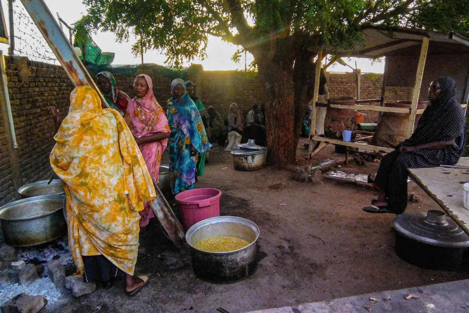 This picture taken on June 20, 2023, shows a charity kitchen providing food for the displaced at a camp in Wad Madani, the capital of Sudan's al-Jazirah state. (Photo by AFP)