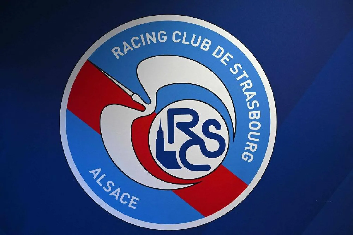 The logo of the RC Strasbourg Alsace is pictured in the press room of the Meinau stadium ahead of the French L1 football match between RC Strasbourg Alsace and FC Lorient at the Meinau stadium in Strasbourg on November 13, 2022. (AFP) 