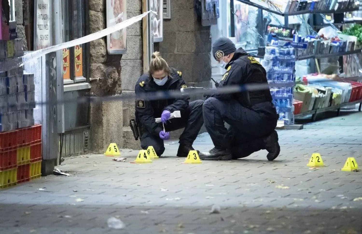 In this file photo taken late Saturday, Nov. 9, 2019, police officers work near the scene of a shooting, in Malmo, Sweden. (Johan Nilsson/TT News Agency via AP)

