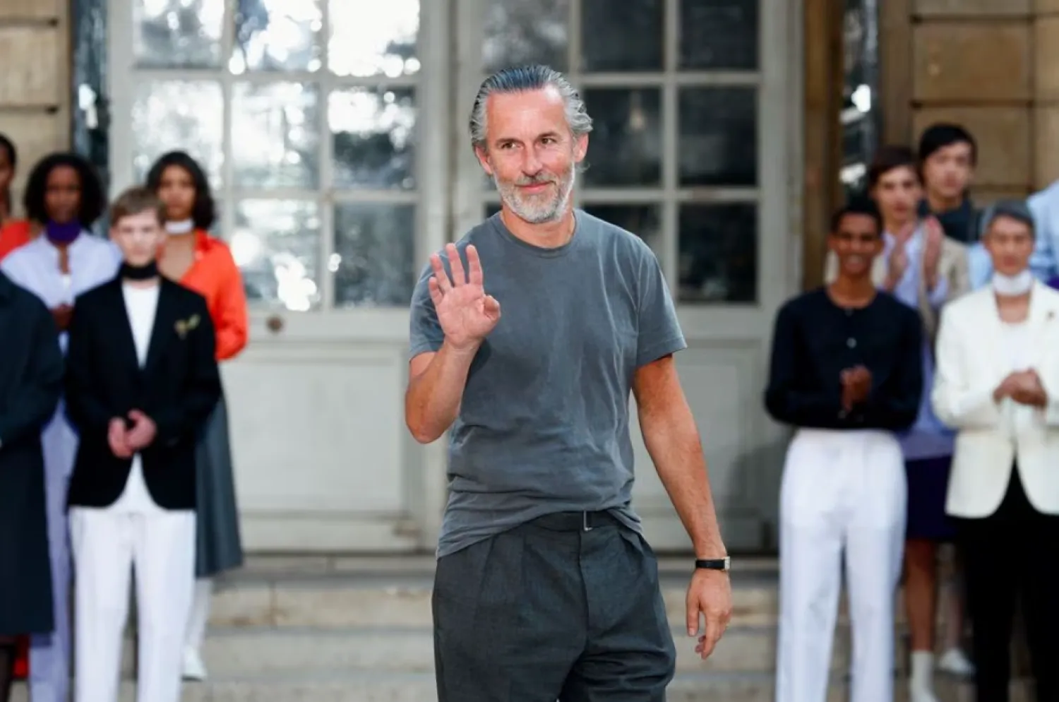 Designer Pierre Maheo gestures next to models who present his creations for the fashion brand Officine Generale as part of its Menswear ready-to-wear Spring/Summer 2024 collection show during Men's Fashion Week in Paris, France, June 23, 2023. REUTERS/Gonzalo Fuentes
