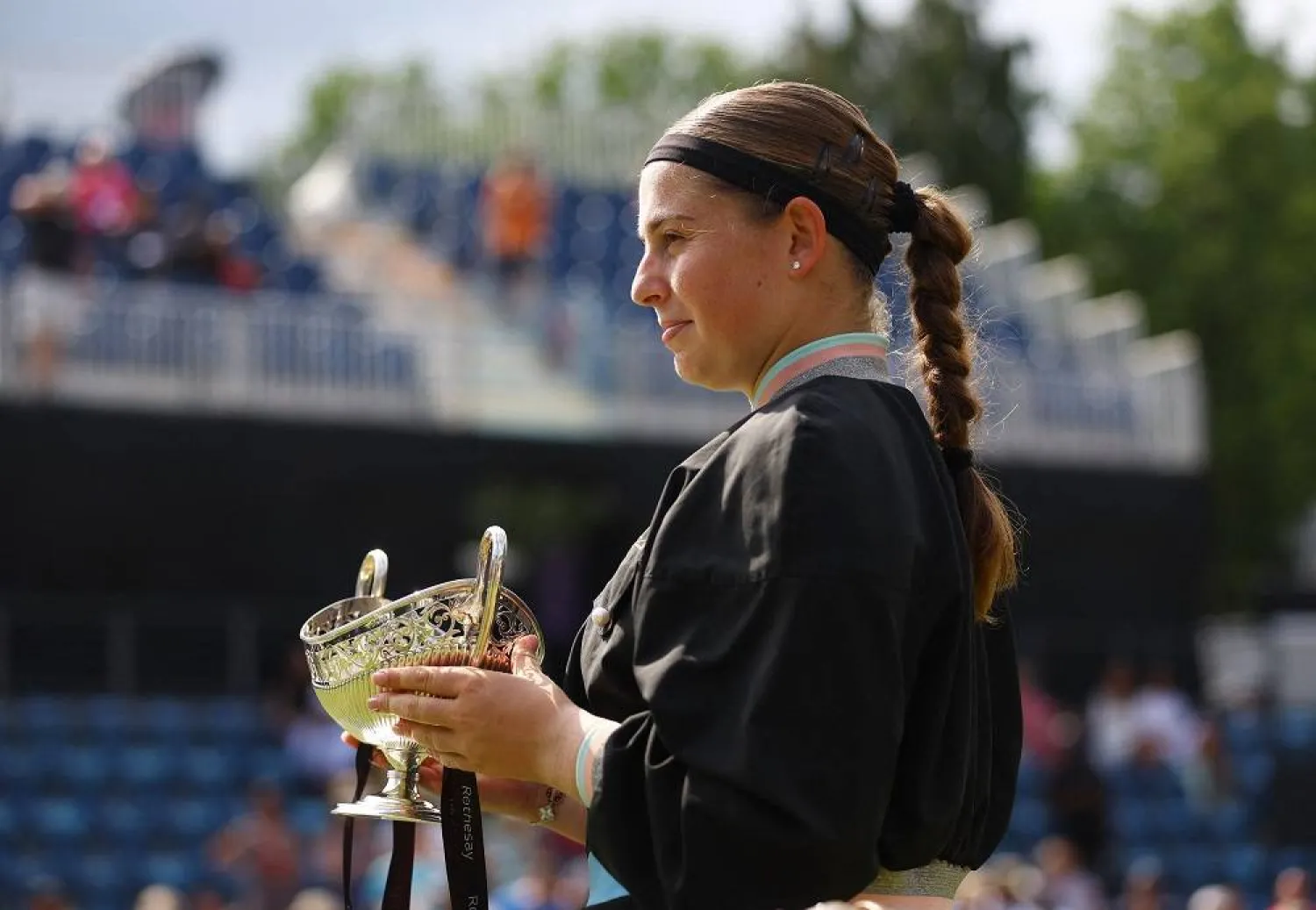  Tennis - WTA 250 - Birmingham Classic - Edgbaston Priory Club, Birmingham, Britain - June 25, 2023 Latvia's Jelena Ostapenko celebrates with the trophy after winning her final match against Czech Republic's Barbora Krejcikova. (Reuters)