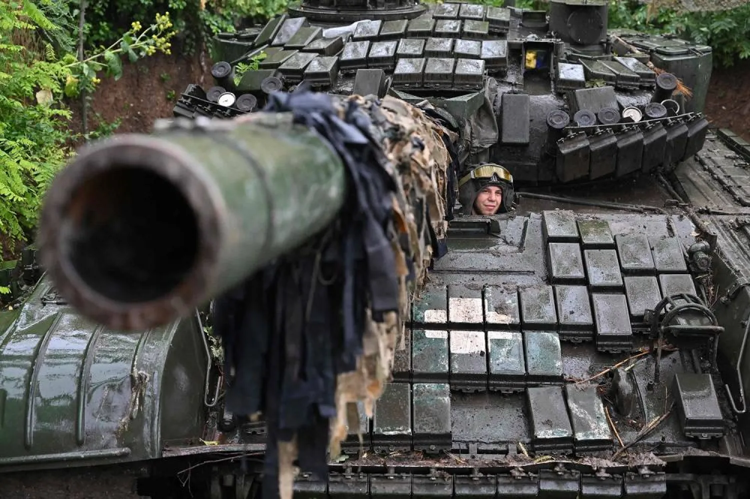 A Ukrainian serviceman sits on a T-72 tank at a position in the Donetsk region on June 25, 2023, amid the Russian invasion of Ukraine. (AFP)