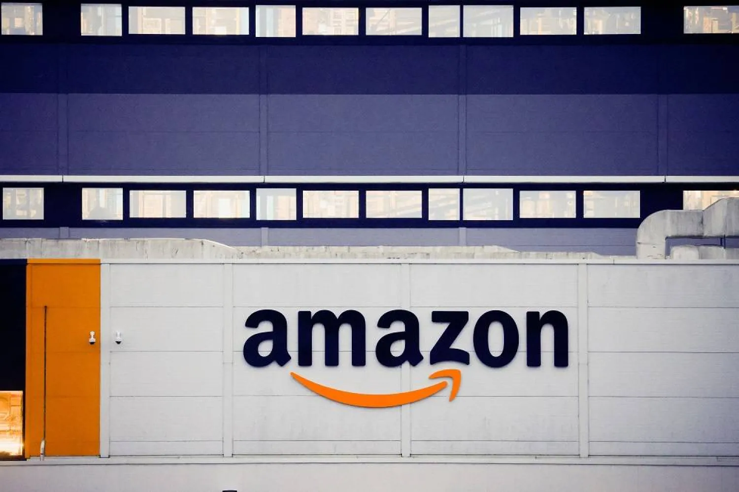 The logo of Amazon is seen at the company's logistics center in Bretigny-sur-Orge, near Paris, France, December 7, 2021. (Reuters)