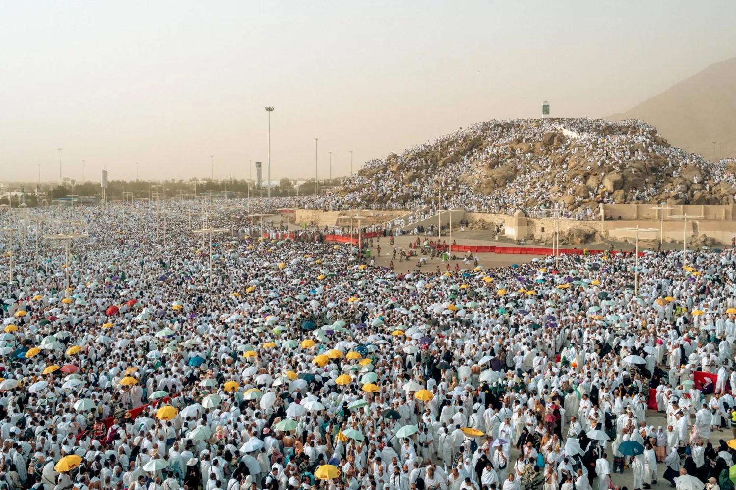 HANDOUT - 27 June 2023, Saudi Arabia, Makkah: Muslim pilgrims pray on the plains of Mount Arafat, also known as Jabal al-Rahma (Mount of Mercy), during the Hajj pilgrimage. Photo: dpa 