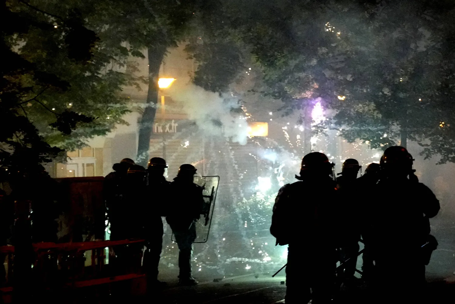 Police forces clash with youths in Nanterre, outside Paris, Thursday, June 29, 2023. (AP Photo/Christophe Ena)