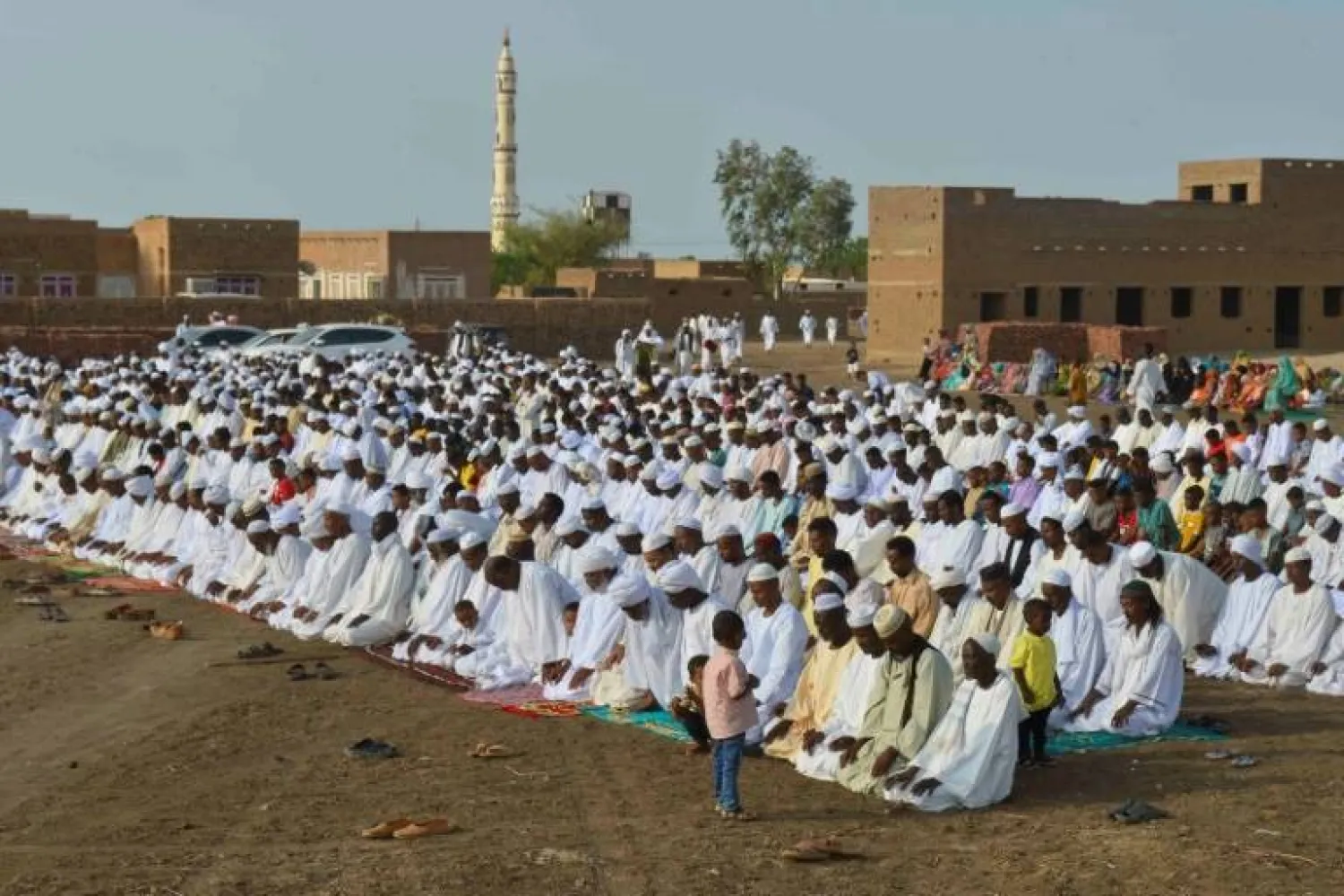 Sudanese Muslim worshippers who fled violence in Khartoum gather for Eid al-Adha prayers in Jazira region, south of the capital - AFP
